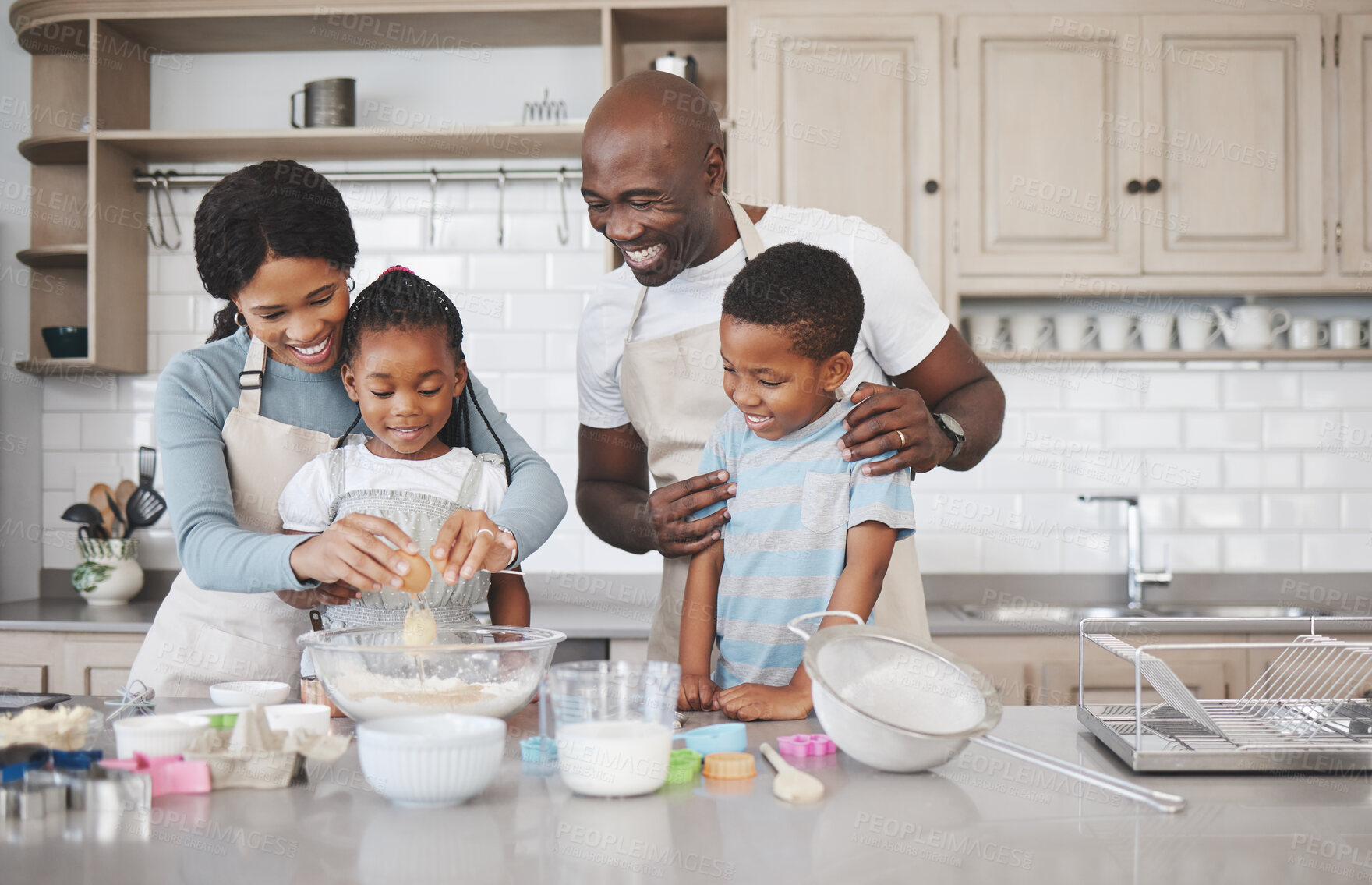 Buy stock photo Baking, smile and black family in kitchen for bonding, learning and skill development in home. Mixing bowl, ingredients and African parents teaching children to cook for growth and fun at house.