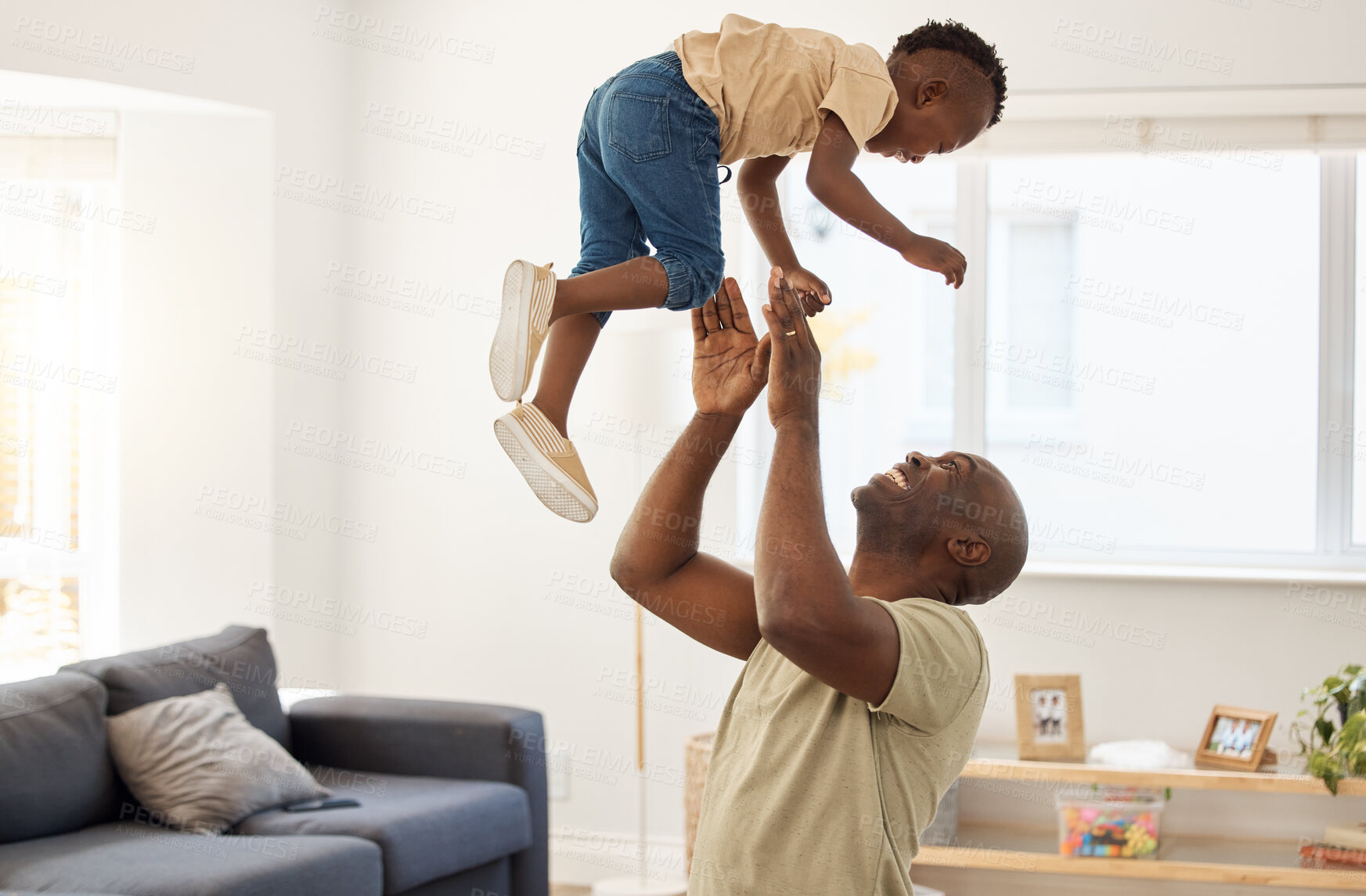 Buy stock photo Shot of a father and son spending time together at home