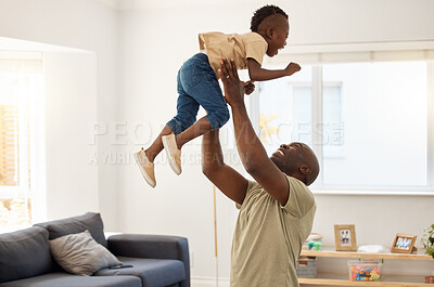 Buy stock photo Shot of a father and son spending time together at home