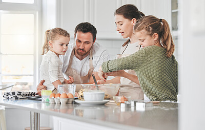 Buy stock photo Mom, dad and kids in kitchen baking together for learning skills, development and bonding. Family, home and happy mother, father and girls with ingredients for cake, treats and dessert for bake sale