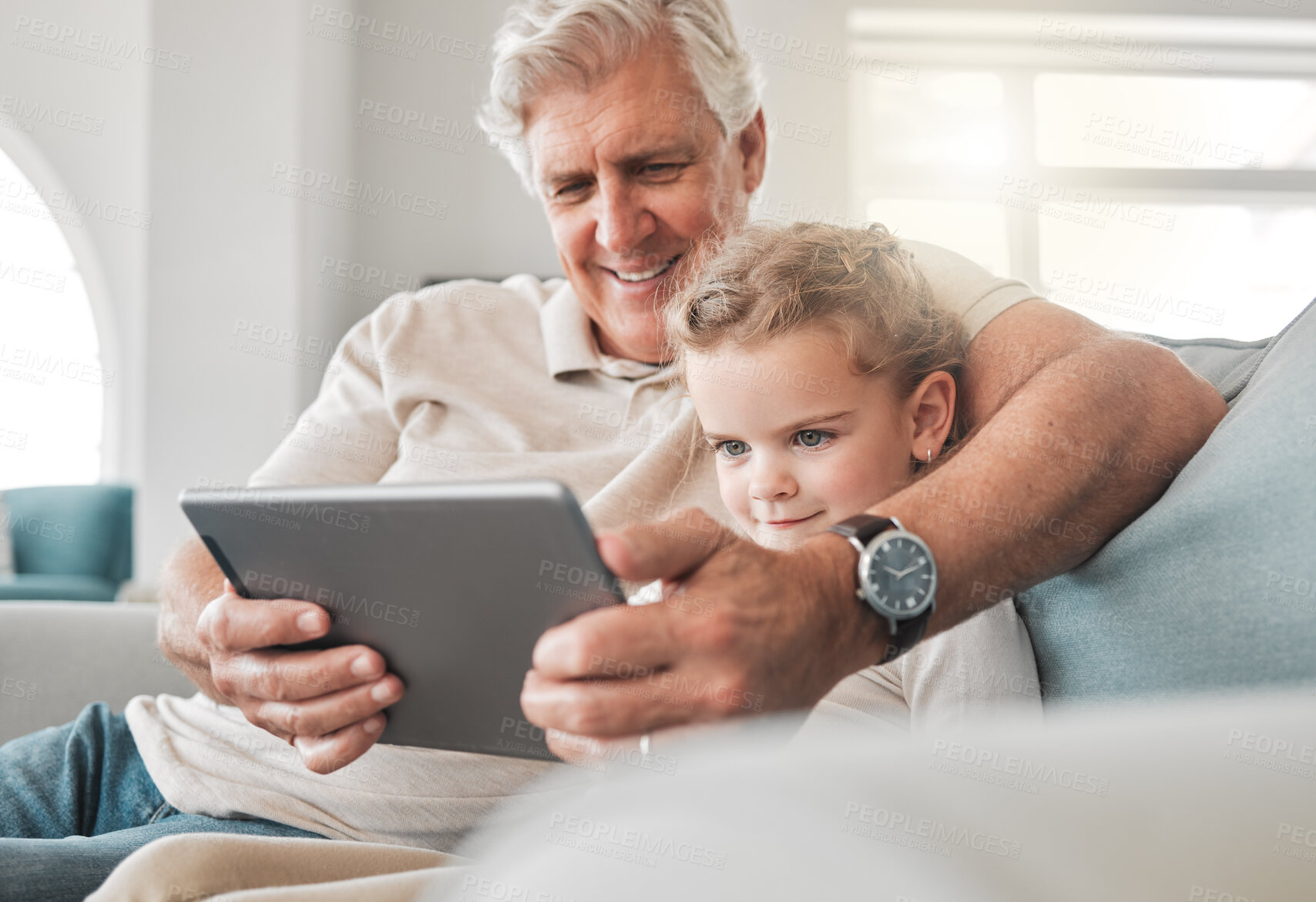 Buy stock photo Tablet, relax and grandfather with child on sofa watching movie, show or film on streaming website. Happy, bonding and senior man with girl kid streaming video on digital technology in lounge at home