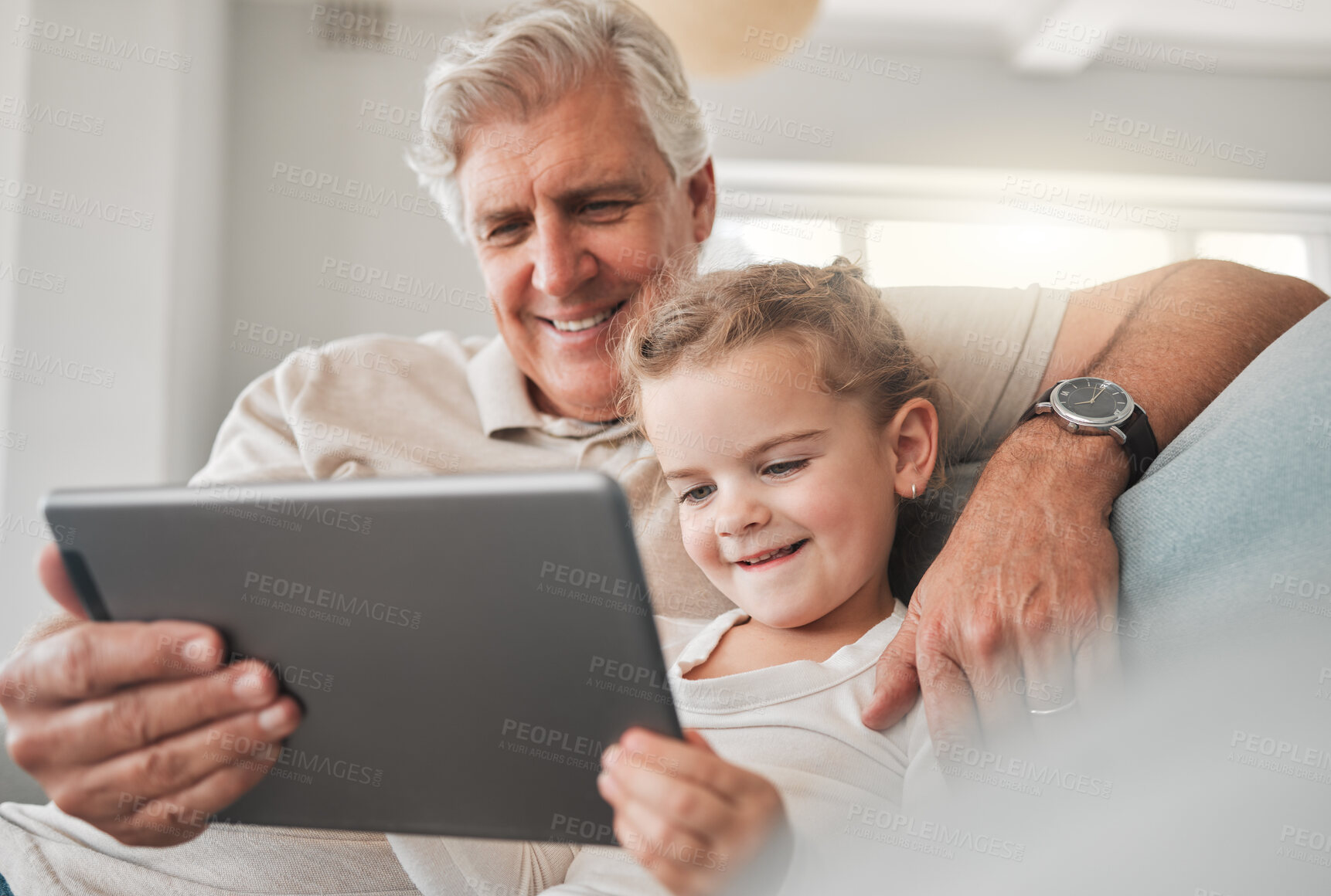 Buy stock photo Reax, sofa and grandfather with child on tablet for watching videos, online cartoons and streaming movies. Family, home and grandpa with girl on digital tech for bonding, relationship and happy