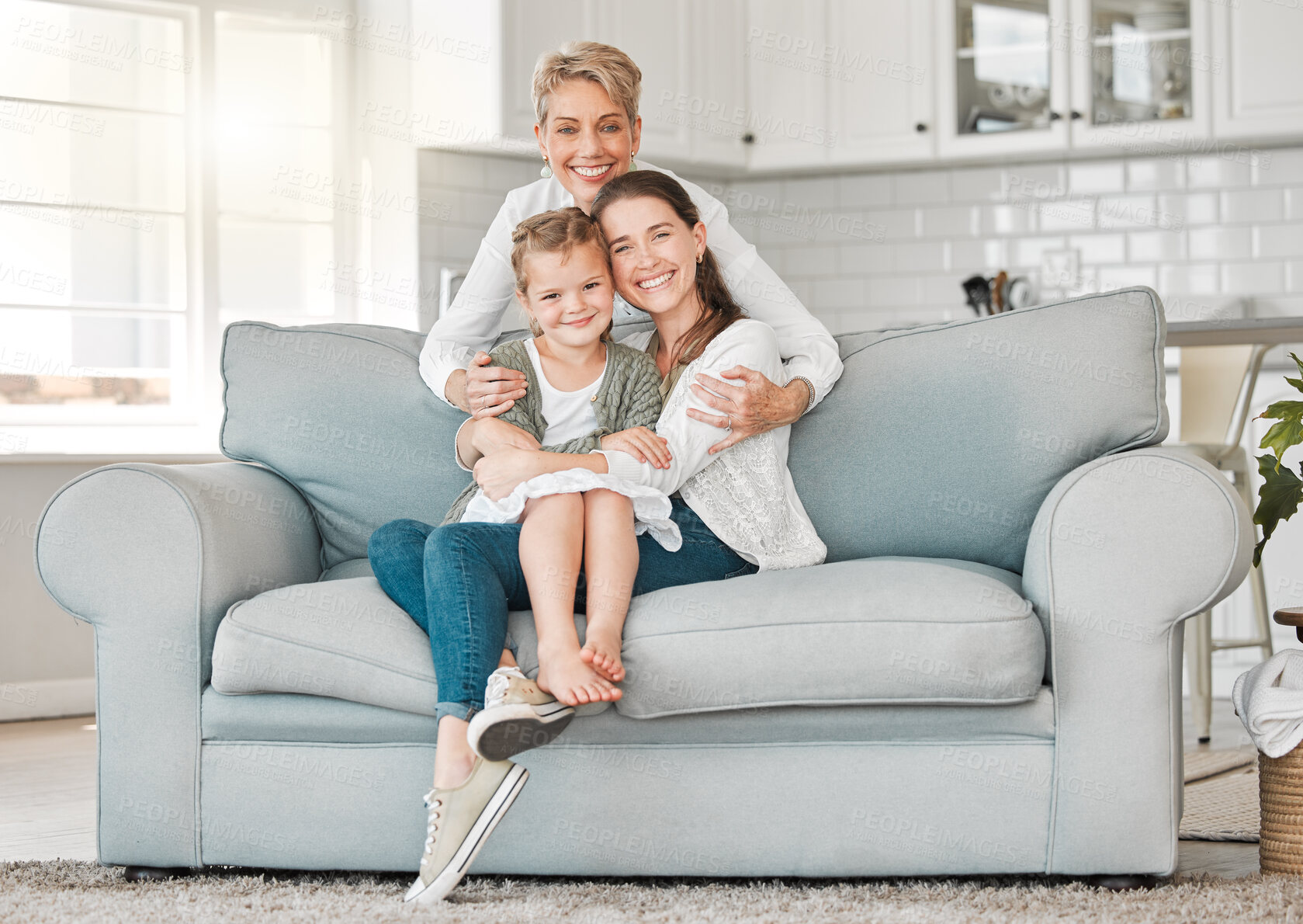 Buy stock photo Family, portrait and relax in house for bonding, care and happiness on sofa with joy, embrace and fun. Generations, smile and people with hug for love, relationship and motherhood in lounge on couch
