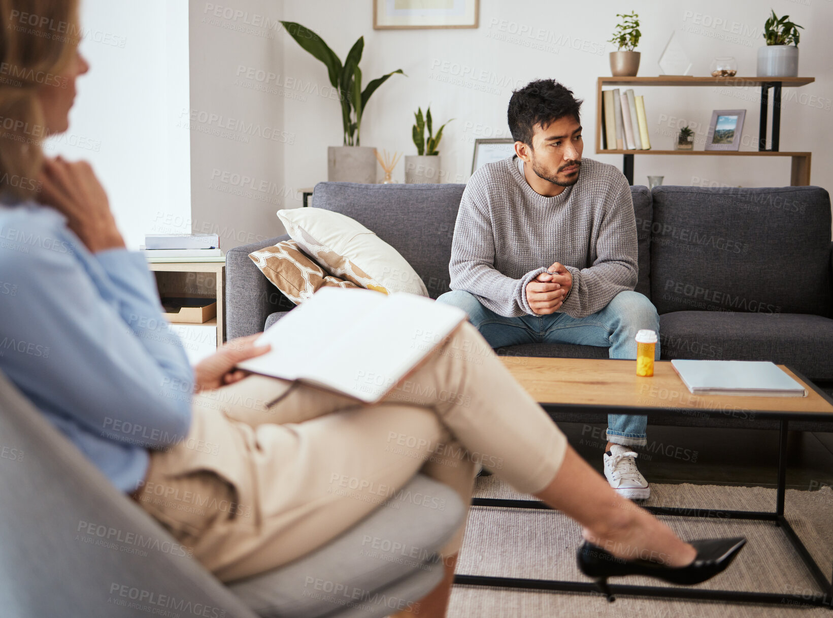 Buy stock photo Depression, psychologist and talking to man patient on sofa for medical support, anxiety risk and trauma. Counseling, doctor and consultation for mental health and medication prescription for ptsd