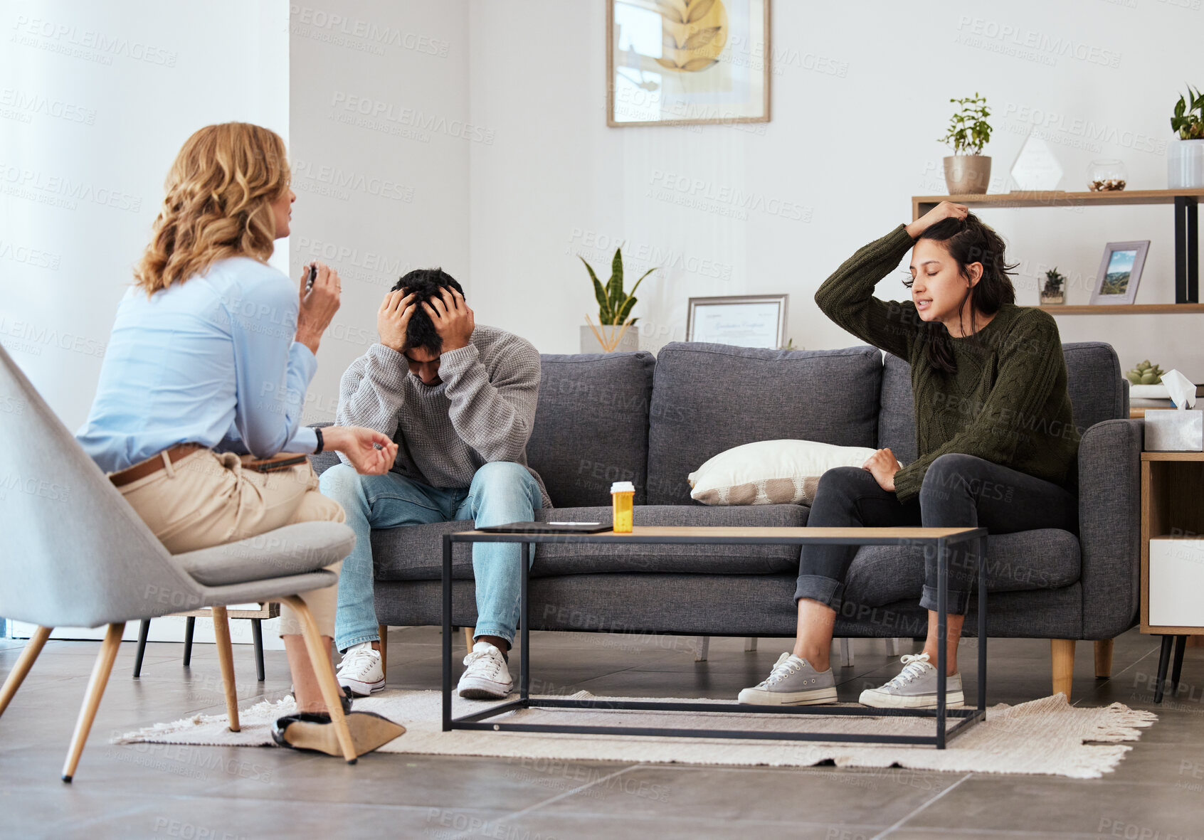 Buy stock photo Shot of a couple having an argument during a counseling session with a therapist