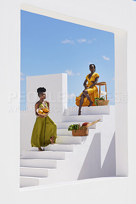 Buy stock photo Shot of two beautiful women posing on a staircase  outside