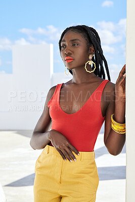 Buy stock photo Cropped shot of an attractive young woman posing on a rooftop outdoors