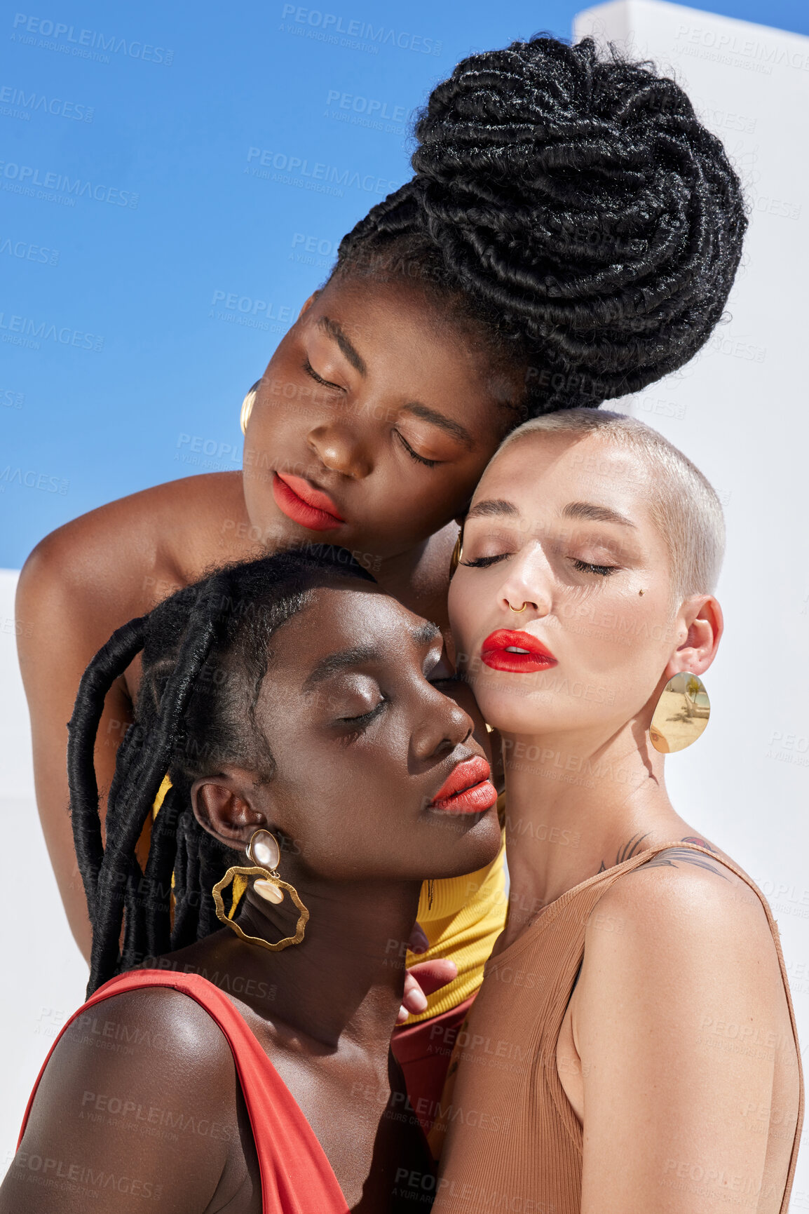 Buy stock photo Cropped shot of three attractive young women posing on a rooftop outdoors