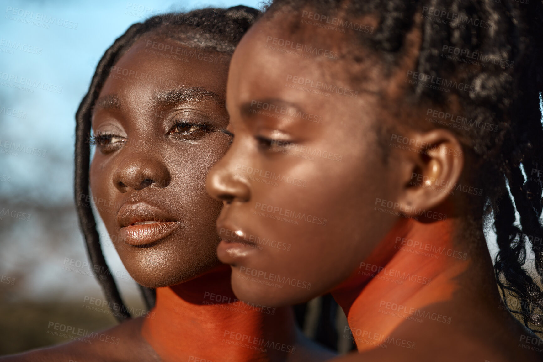 Buy stock photo Shot of two beautiful tribal women posing outside together