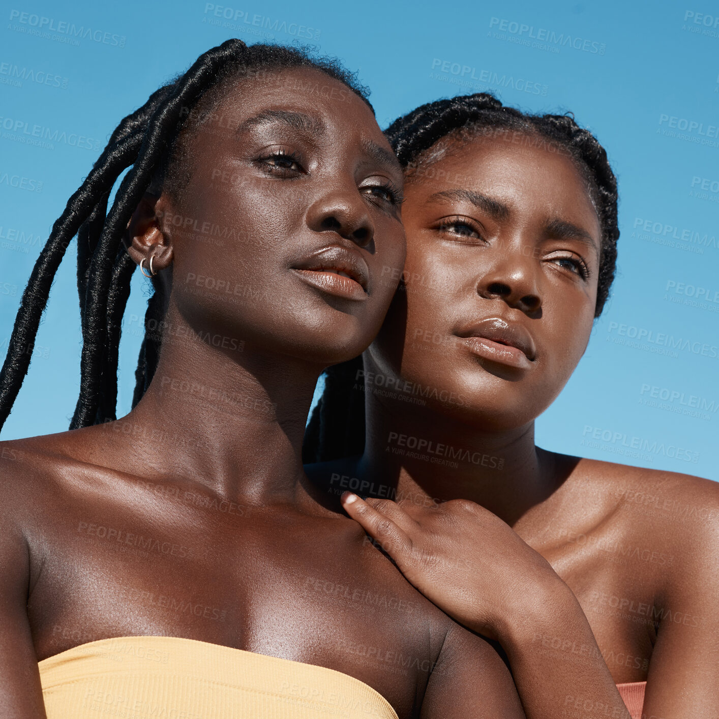 Buy stock photo Cropped shot of two attractive young women posing outside