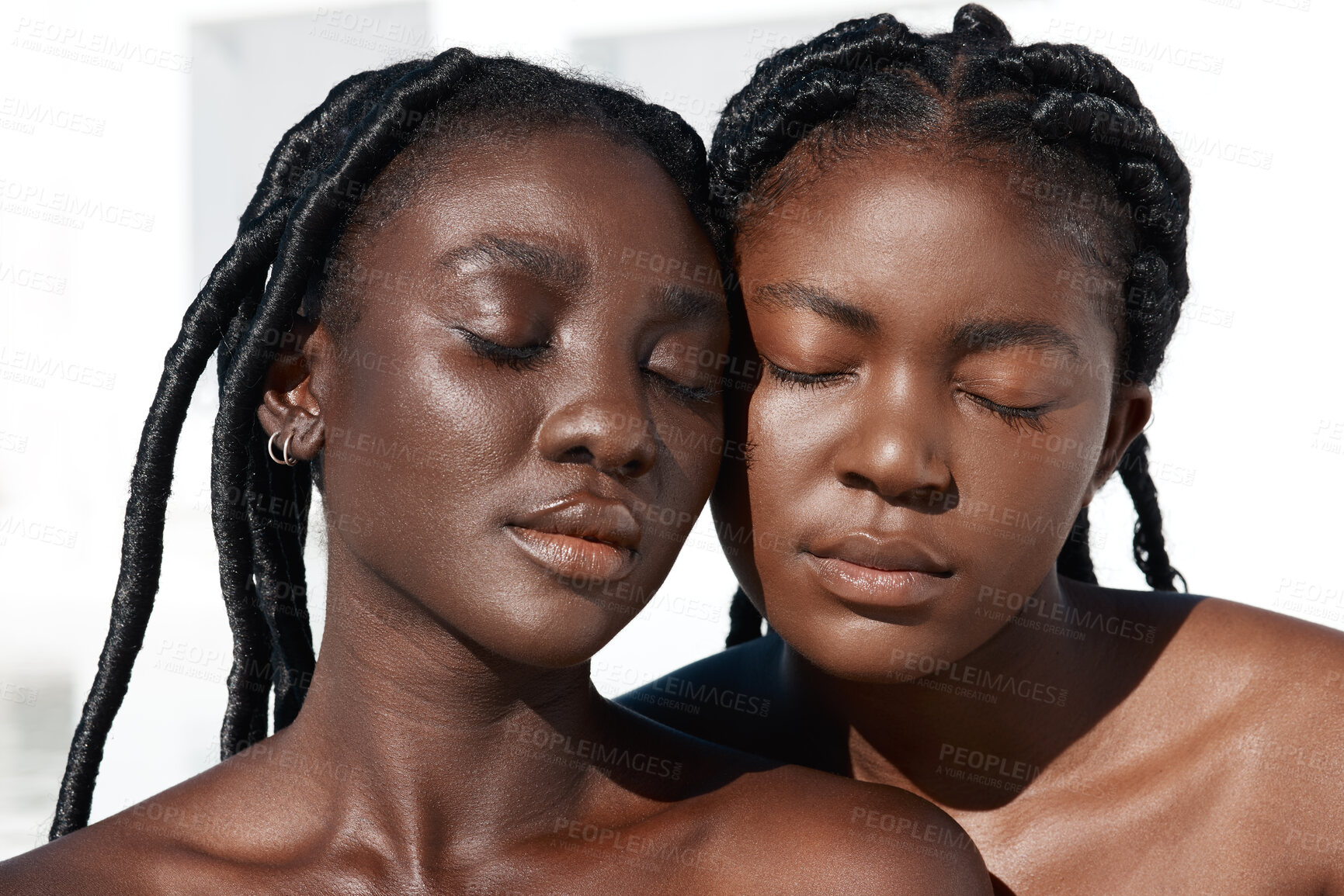 Buy stock photo Cropped shot of two attractive young women posing outside