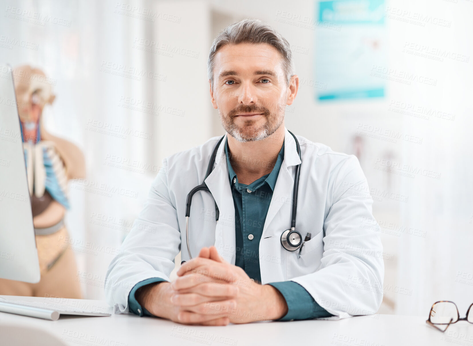 Buy stock photo Portrait of a mature doctor working in a medical office