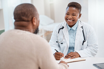 Buy stock photo Shot of a young doctor writing notes during a consultation with a patient in a medical office