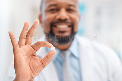 Buy stock photo Closeup shot of a doctor holding a round white tablet