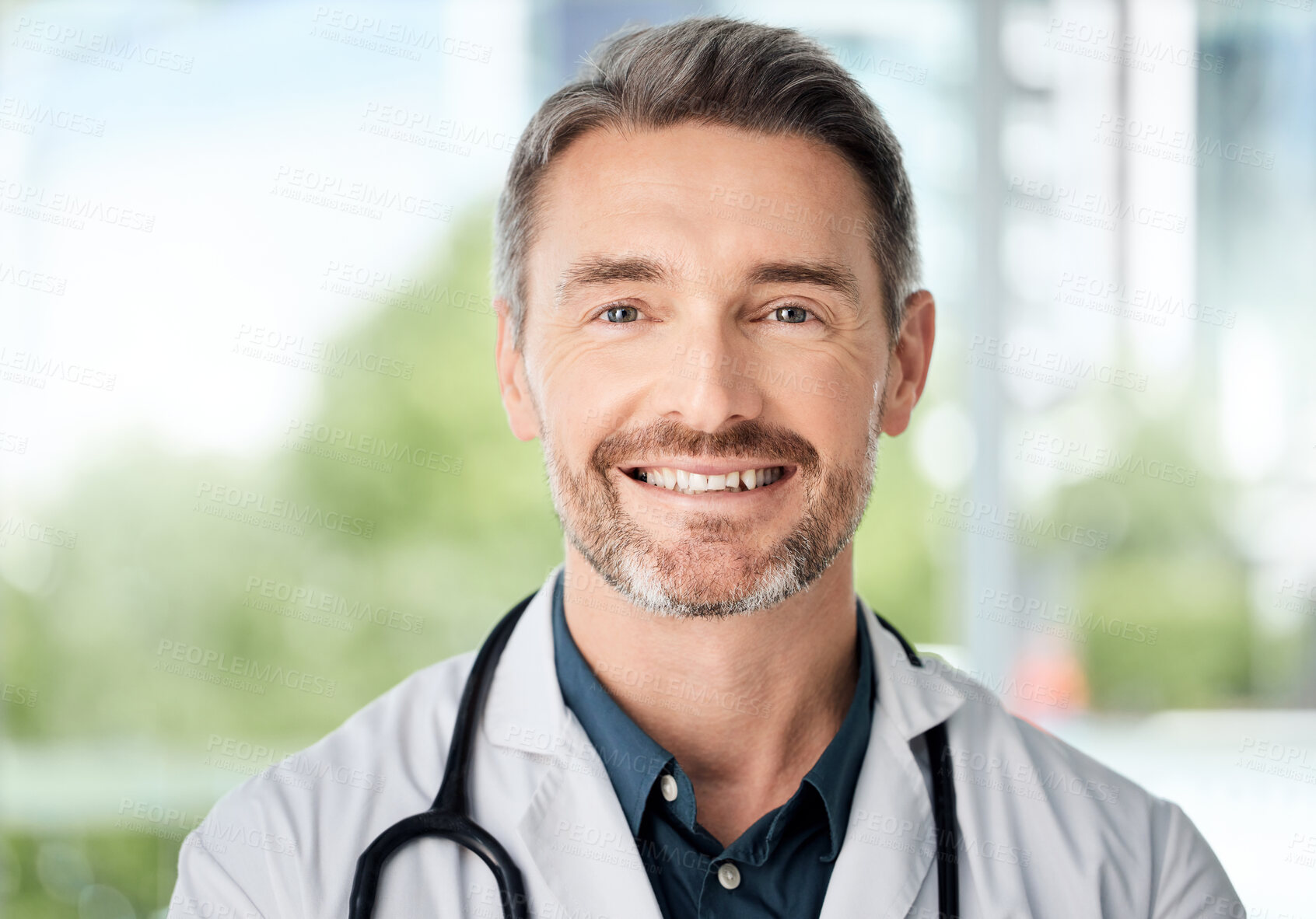 Buy stock photo Shot of a doctor standing in a modern office