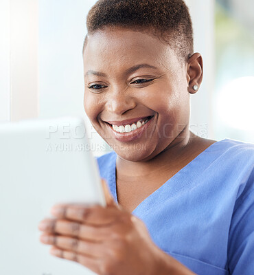 Buy stock photo Shot of a young nurse using a tablet in a office