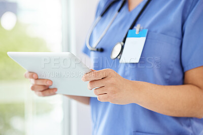 Buy stock photo Shot of a unrecognizable nurse using a tablet in a office