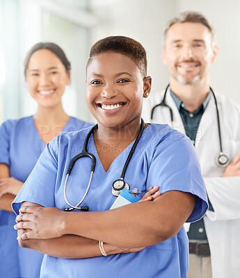 Buy stock photo Shot of a group of medical practitioners standing together in a hospital