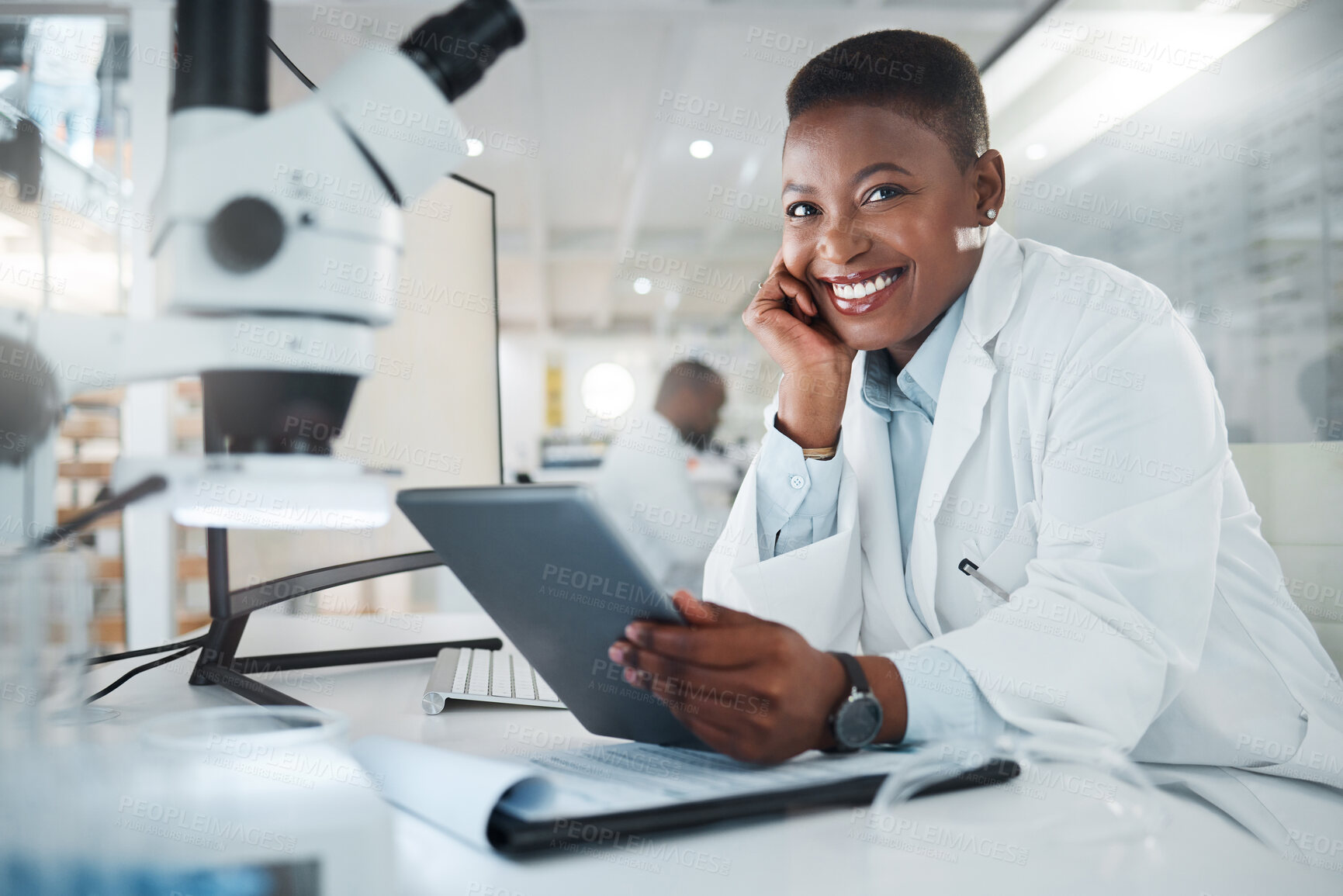 Buy stock photo Shot of a young scientist using a digital tablet while working in a lab