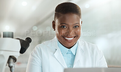 Buy stock photo Shot of an attractive young scientist sitting alone in her laboratory