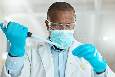 Buy stock photo Shot of a mature scientist using a test tube and dropper in the laboratory