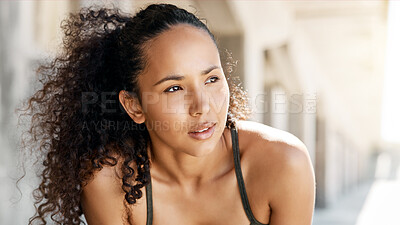 Buy stock photo Shot of an attractive young woman taking a moment to catch her breath during her outdoor workout