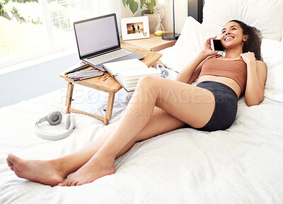 Buy stock photo Shot of a young woman on a call at home