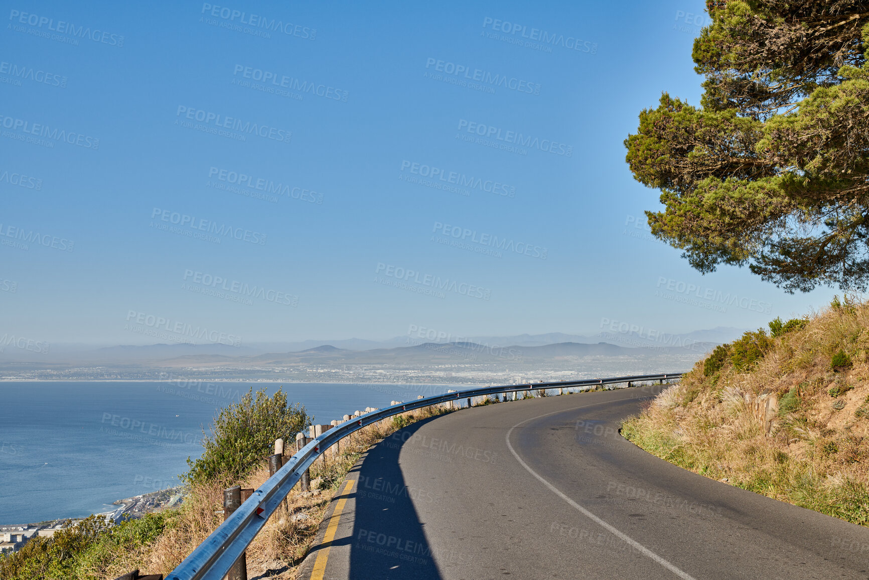 Buy stock photo Landscape, mountain road and sky with ocean in summer, asphalt and highway with environment in nature. Outdoor, horizon and space with motorway, transport and infrastructure for travel at seaside