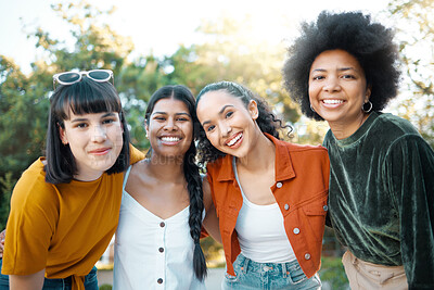 Buy stock photo Shot of a group of female friends spending time together at a park