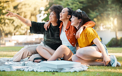 Buy stock photo Shot of a group of friends sitting in a park