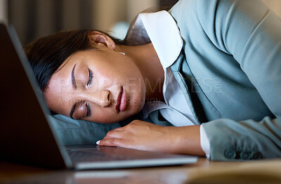 Buy stock photo Cropped shot of an attractive young businesswoman sleeping on her desk while working late at the company offices
