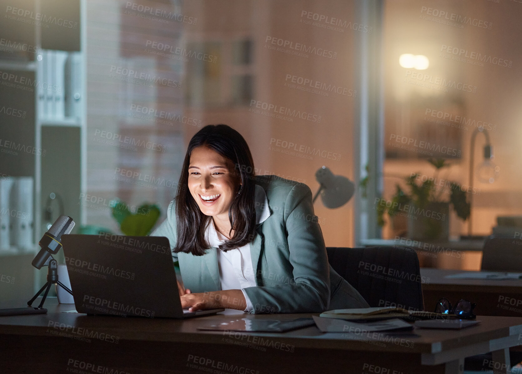 Buy stock photo Cropped shot of an attractive young businesswoman working late at her company offices