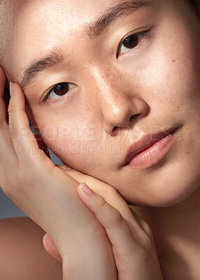 Buy stock photo Closeup shot of a beautiful young woman with freckles on her face