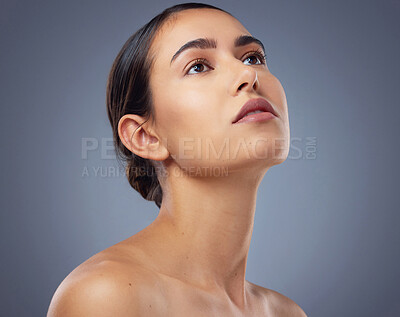 Buy stock photo Studio shot of a beautiful young woman posing against a grey background