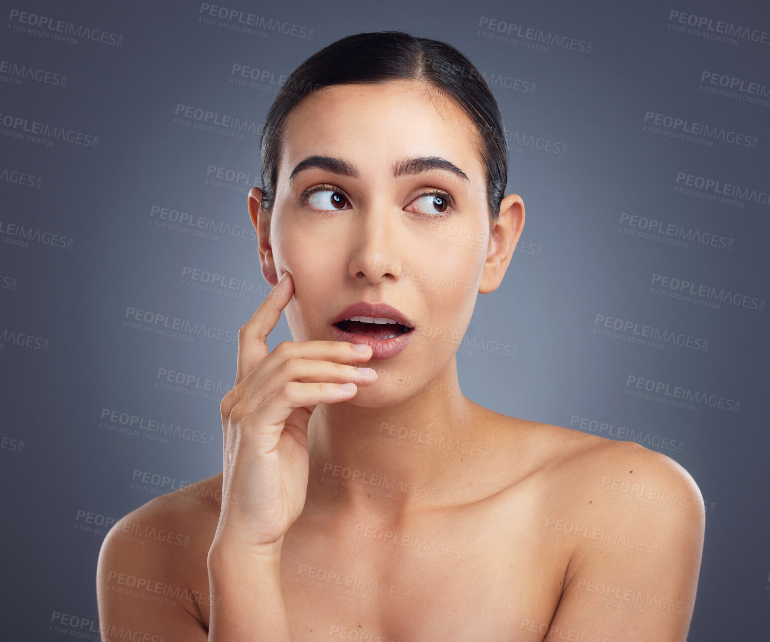 Buy stock photo Studio shot of a beautiful young woman posing against a grey background