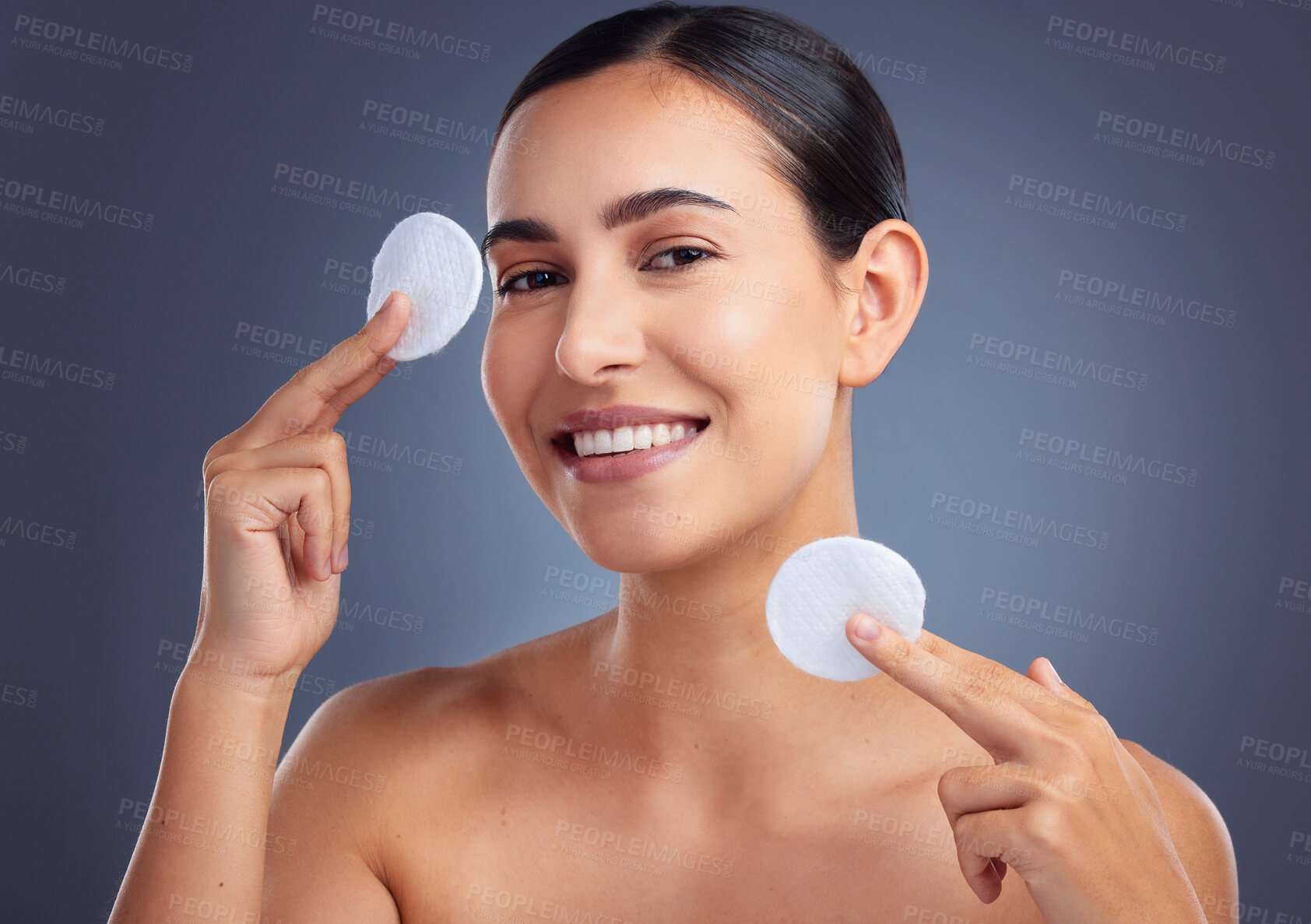 Buy stock photo Studio shot of a beautiful woman holding up cotton pads