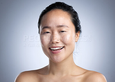 Buy stock photo Shot of a young woman standing against a grey background