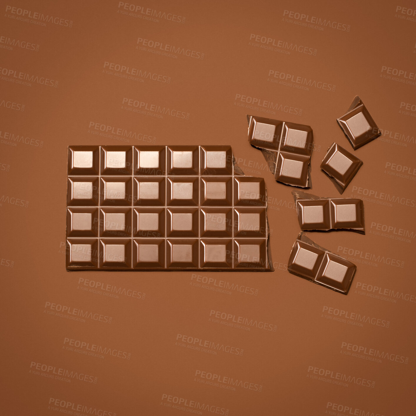 Buy stock photo Broken, chocolate and slab on studio background for snack on diet, metabolism boost and skin health benefits. Brown, candy and bar of cocoa for minerals or stress relief, improve blood flow and food.