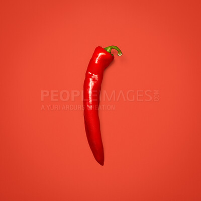 Buy stock photo Ingredient, red chili and isolated by studio background for digestive health, potassium and rich in vitamin c. Mockup space, hot pepper and fresh produce for culinary, seasoning and spicy flavor