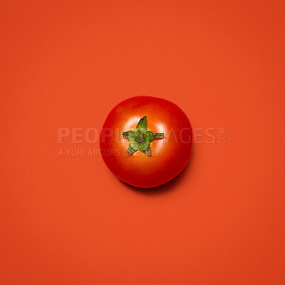 Buy stock photo Above, tomato or ripe in studio for nutrition, healthy eating or addition for salad. Fresh fruit, gut health or bright on red background with vitamin C, antioxidants or lycopene for cancer prevention