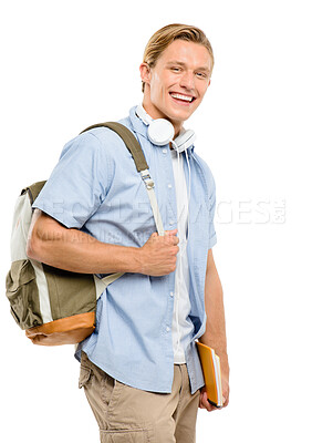 Buy stock photo Shot of a handsome young student standing alone in the studio and holding his textbooks