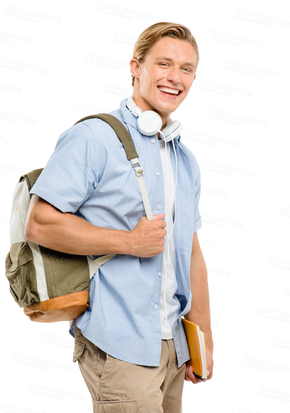 Buy stock photo Shot of a handsome young student standing alone in the studio and holding his textbooks