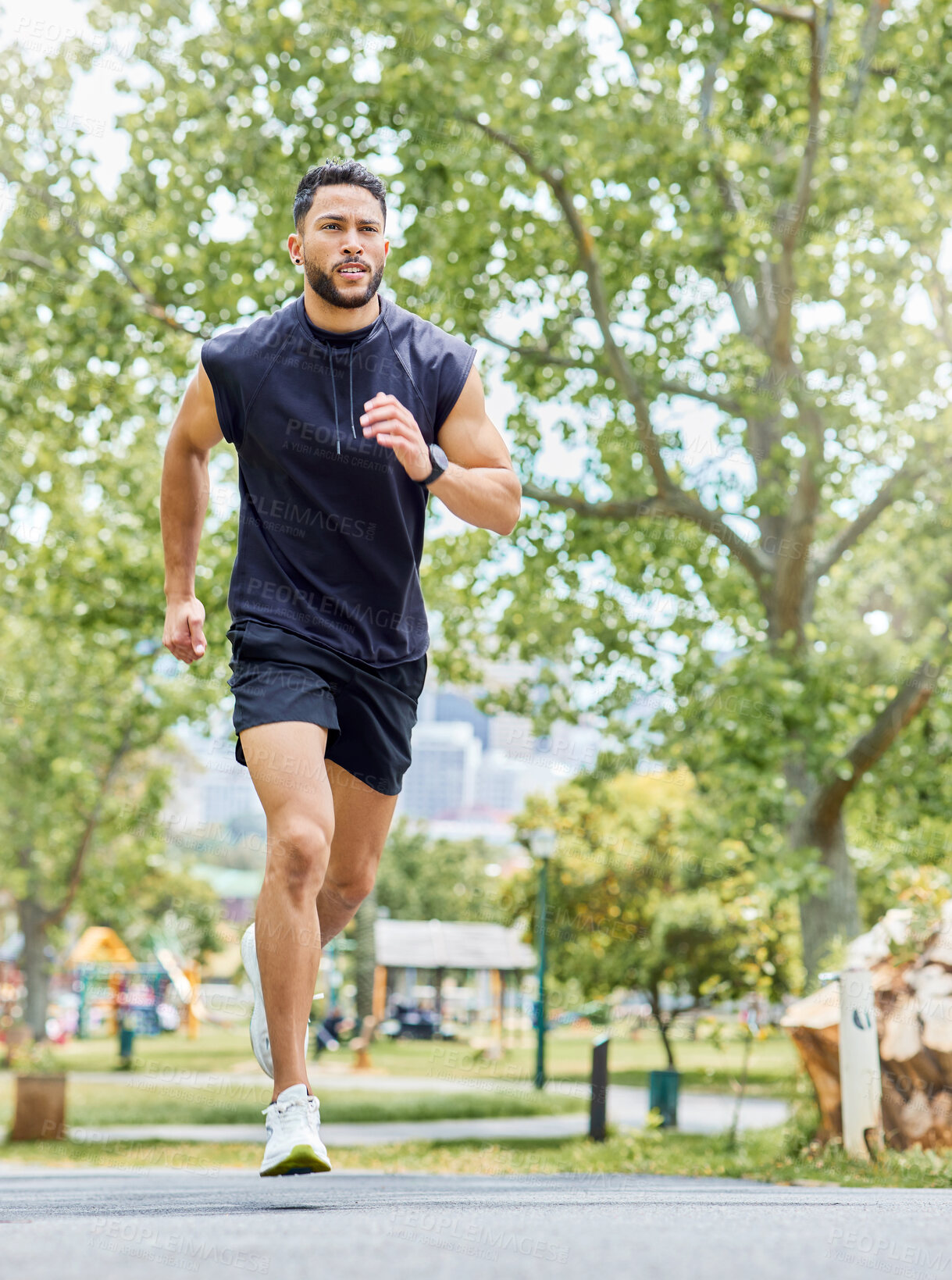 Buy stock photo Shot of a sporty young man running outdoors