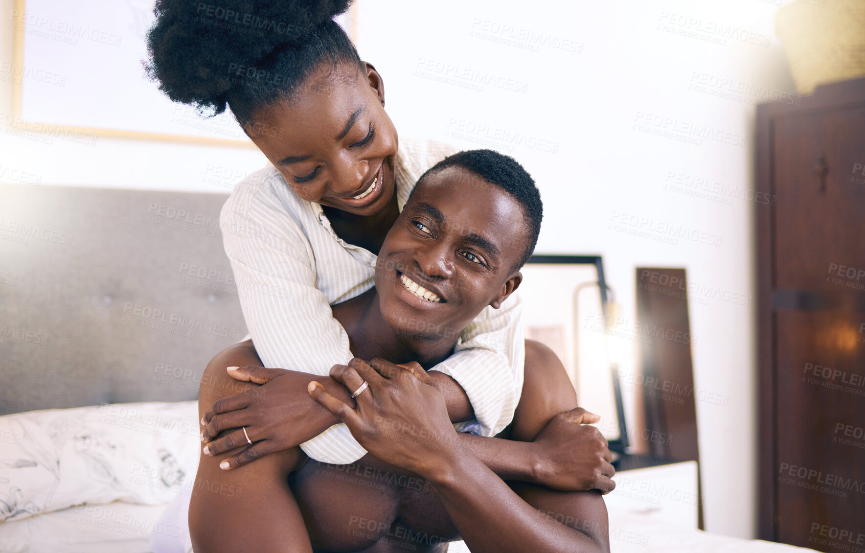 Buy stock photo Shot of a young couple relaxing together at home