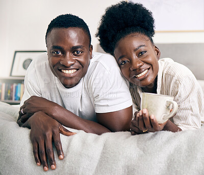 Buy stock photo Shot of a young couple relaxing together at home