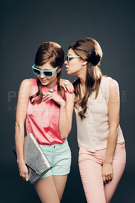 Buy stock photo Fashion, vintage and secret with women and whisper in studio for elegant, pastel and beauty. Sunglasses, confident and cosmetics with female model on dark background for glamour, beehive and style