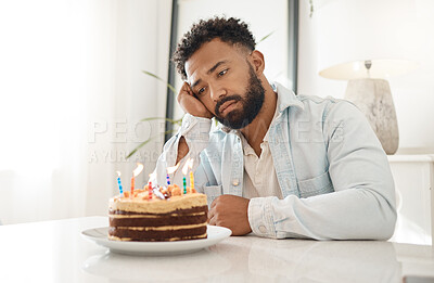 Buy stock photo Shot of a young man celebrating his birthday alone at home
