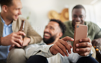 Buy stock photo Shot of a three male friends looking at something on a cellphone together