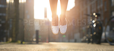 Buy stock photo Shot of a woman jumping mid air in happiness