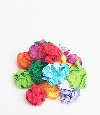 Buy stock photo Colorful, paper or crumble with recycle material for dirt, disposal or pile of trash on a white studio background. Closeup, junk and crumpled sheets or wrapping with isolated rubish, garbage or waste